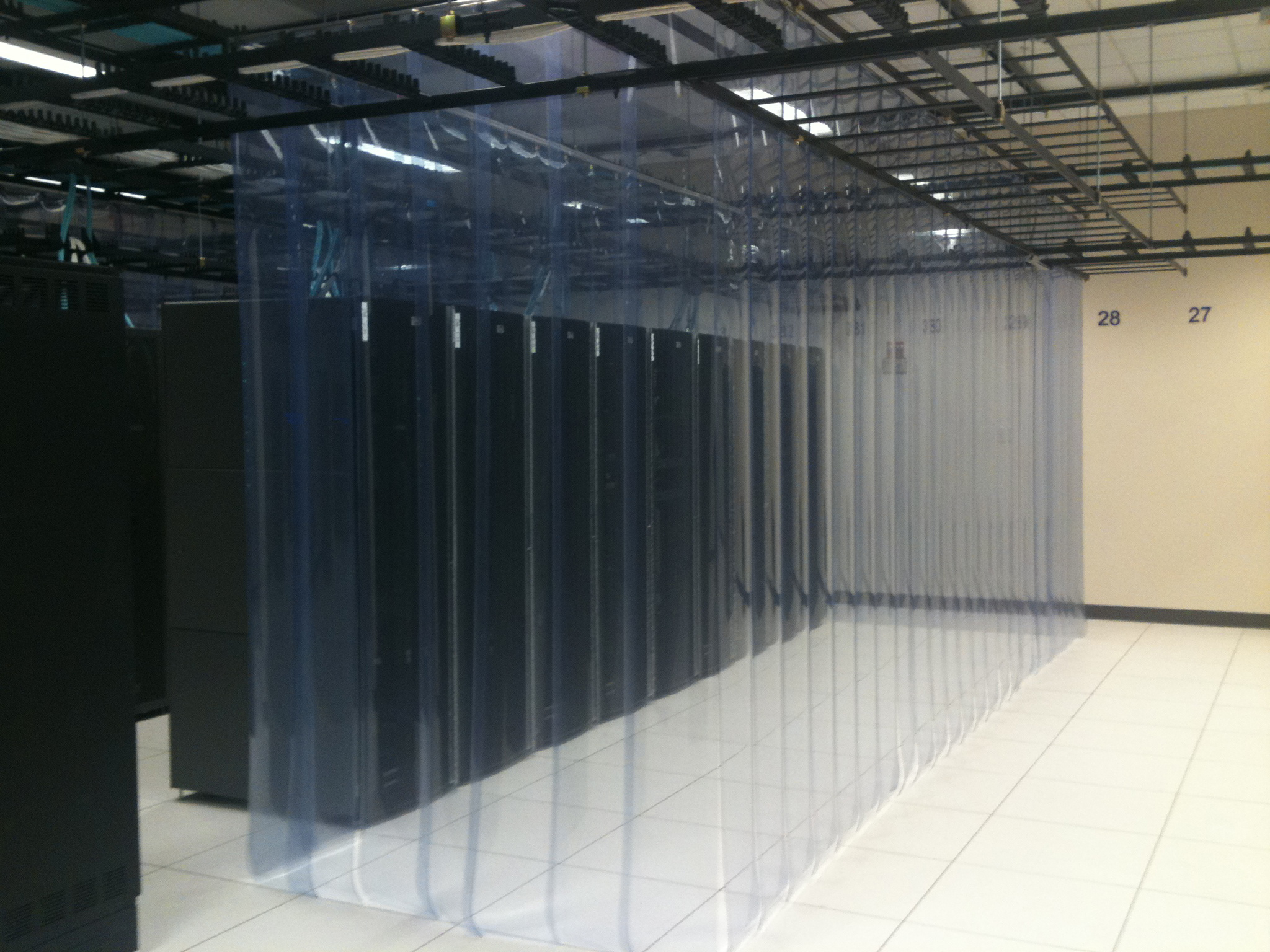 aisle containment transparent strip walls in a data center server room